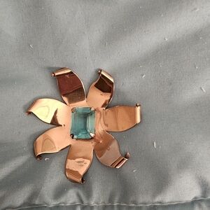 Elegant Copper Flower Brooch with Turquoise Colored Stone